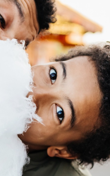 Father & son eating cotton candy header