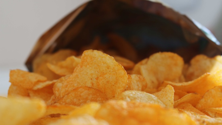 A bag of chips fell over in your direction and spilled the chips.
