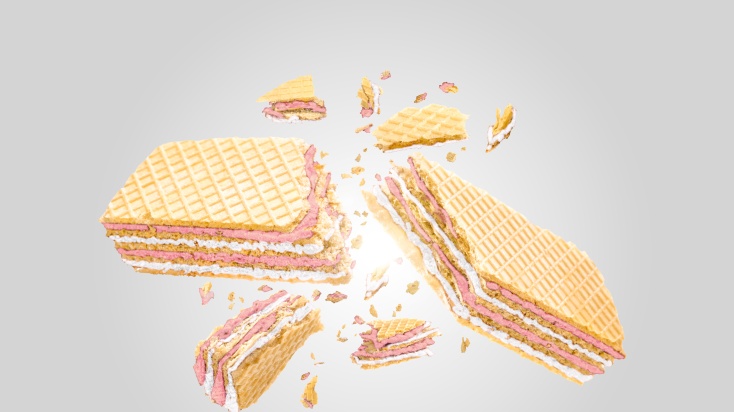 Picture of a crispy Raspberry coconut macaroon wafer, breaking 