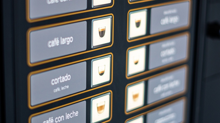 Close up of a selection of coffee specialities at a vending machine
