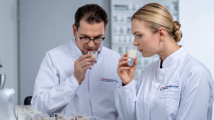 two flavour experts test smelling flavour samples in application lab