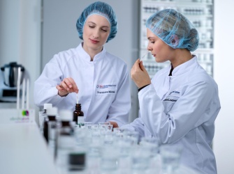 Two flavourists test tasting flavour creatings in application lab