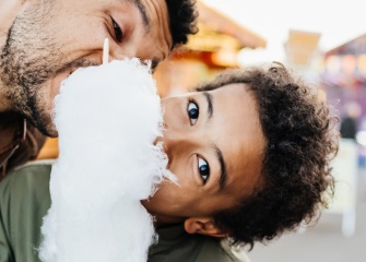 Father & son eating cotton candy header